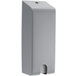 A grey rectangular GOJO security closure with a screw on the top.