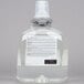 A close up of a white and green GOJO hand soap bottle.