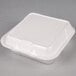 A white Genpak foam container with a hinged lid.