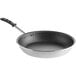 A black and silver Vollrath Wear-Ever frying pan with a black and silver handle.