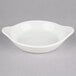 A white stoneware dish with two handles.
