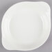 A CAC bone white stoneware shirred egg dish with a small handle.