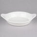 A white bowl with handles.