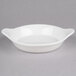 A white stoneware dish with handles.