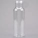 A clear plastic Cal-Mil salad dressing bottle with a clear cap.