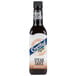 A bottle of Crystal steak sauce with a white label.