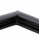 The black corner of a True 810786 equivalent magnetic door gasket.
