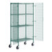 A Regency green wire security shelving unit with wheels and a door open.