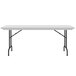 A gray granite Correll rectangular folding table with black legs.