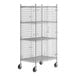 A Regency chrome wire security cage on wheels with four shelves.