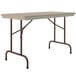 A mocha granite Correll rectangular folding table with metal legs.