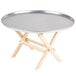 A Tablecraft mini table tray stand with a natural finish on a round table.