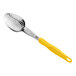 A Vollrath Jacob's Pride perforated basting spoon with a yellow handle.