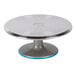 An Ateco revolving aluminum cake turntable with a blue non-slip base.