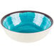 A blue bowl with a white rim.