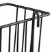 A black wire storage basket with a handle and smoked glass panel on the front.