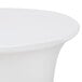 A white Snap Drape Contour spandex table cover on a round table.