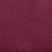 A close-up of a burgundy Snap Drape Contour table cover.
