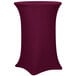 A burgundy Snap Drape Contour spandex table cover on a round bar height table.