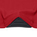 A crimson Snap Drape Contour table cover on a round table in a bar.