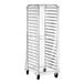 A clear plastic covered rack with shelves on wheels.