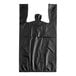 A black plastic t-shirt bag with handles.