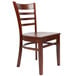 A Lancaster Table & Seating mahogany wood ladder back chair with mahogany wood seat.