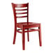 A mahogany wood Lancaster Table & Seating ladder back chair with a mahogany wood seat.