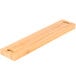 A rectangular bamboo knife holder strip.