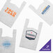 A group of white plastic T-shirt bags with logos on them.