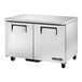 A silver True TUC-48F-HC undercounter freezer with wheels.