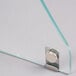 A close-up of the glass on a Excellence Straight Glass Sneeze Guard.