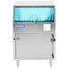 A Jackson Delta underbar glass washer with a blue curtain.
