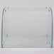 A clear curved glass sneeze guard.