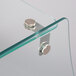 A curved glass shelf with metal brackets.