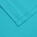 A close up of a teal poly/cotton fabric.