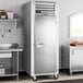 A Traulsen G Series reach-in refrigerator with a solid door.