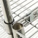 A metal pipe on a Metro Super Erecta wire shelf.