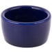 A close-up of a Tuxton cobalt blue China pipkin ramekin with a small rim.