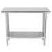 A stainless steel Advance Tabco work table with an undershelf.