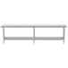 An Advance Tabco stainless steel work table with undershelf on legs.