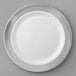 A white Visions plastic plate with a silver lattice design.