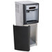 A silver metal Follett 7 Series Chewblet ice maker with a black door open.