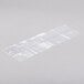 A clear plastic bag with white text on a white surface.