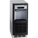 A silver and black Follett 7 Series undercounter ice maker and water dispenser.