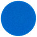 A blue circular Scrubble floor pad with small scrunched edges.
