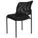 A black Flash Furniture stackable side chair with a mesh back.