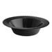 A black Visions Wave plastic bowl with a wavy edge.