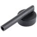 A black tube on a black round object with a metal handle.