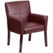 A burgundy leather Flash Furniture reception chair with mahogany legs.